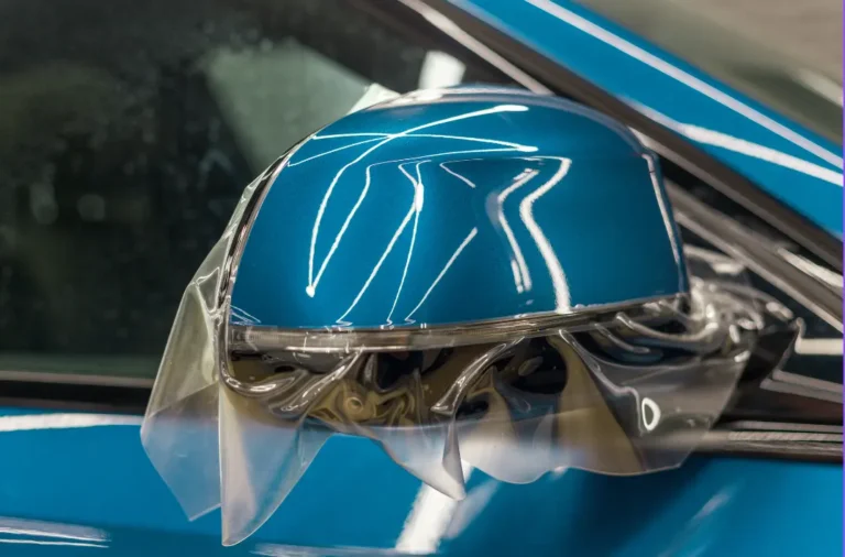 PPF being installed on a vehicle's side mirror